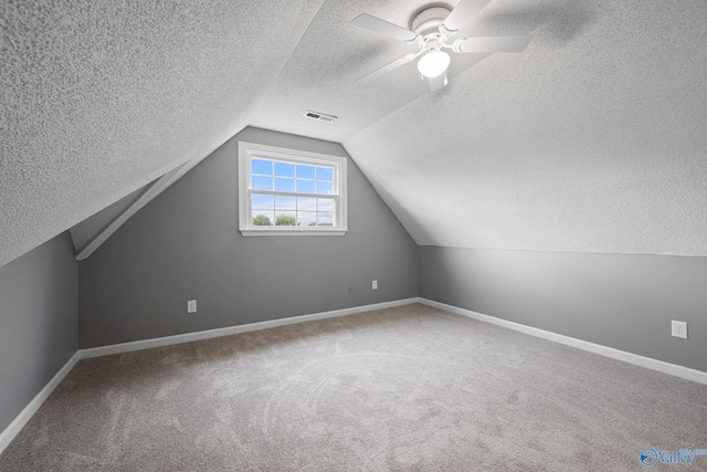 127 Patdean Dr, Huntsville, AL 35811 - bonus room featuring a textured ceiling, carpet, lofted ceiling, and ceiling fan