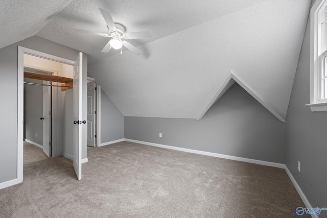 127 Patdean Dr, Huntsville, AL 35811 - bonus room with vaulted ceiling, carpet, ceiling fan, and a textured ceiling