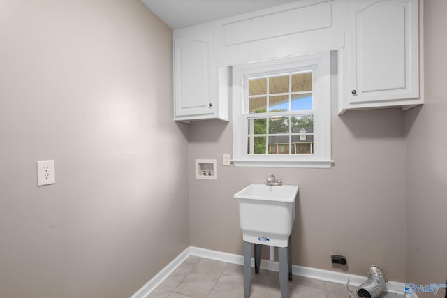127 Patdean Dr, Huntsville, AL 35811 - laundry area with cabinet space, washer hookup, and light tile patterned floors