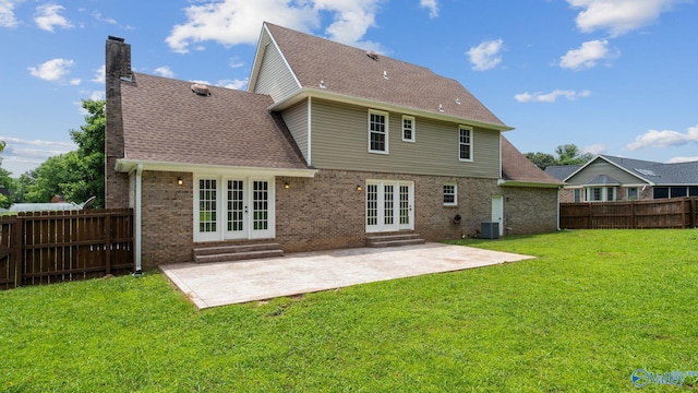 127 Patdean Dr, Huntsville, AL 35811 - rear view of property featuring french doors, a chimney, entry steps, brick siding, and a fenced backyard
