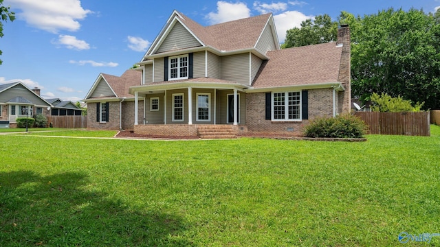 127 Patdean Dr, Huntsville, AL 35811 - view of front facade with brick siding, a porch, a chimney, and a shingled roof