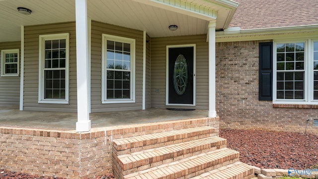 127 Patdean Dr, Huntsville, AL 35811 - entrance to property with a porch, a shingled roof, and brick siding