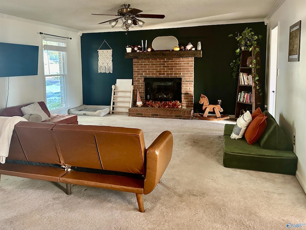 carpeted living room with a fireplace, a ceiling fan, and crown molding