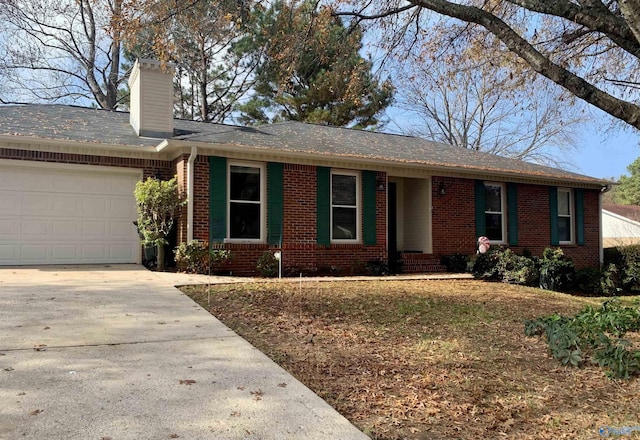 ranch-style house with a garage, driveway, brick siding, and a chimney