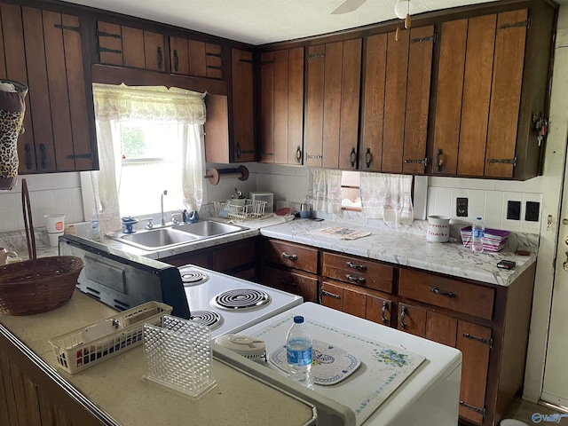 kitchen with a sink and light countertops
