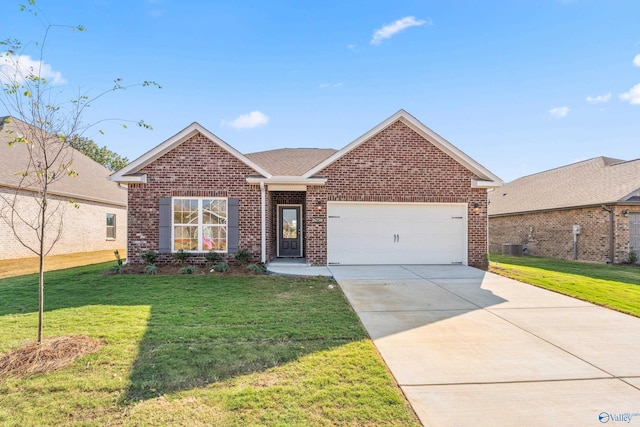 view of front of home featuring a front yard, a garage, and cooling unit