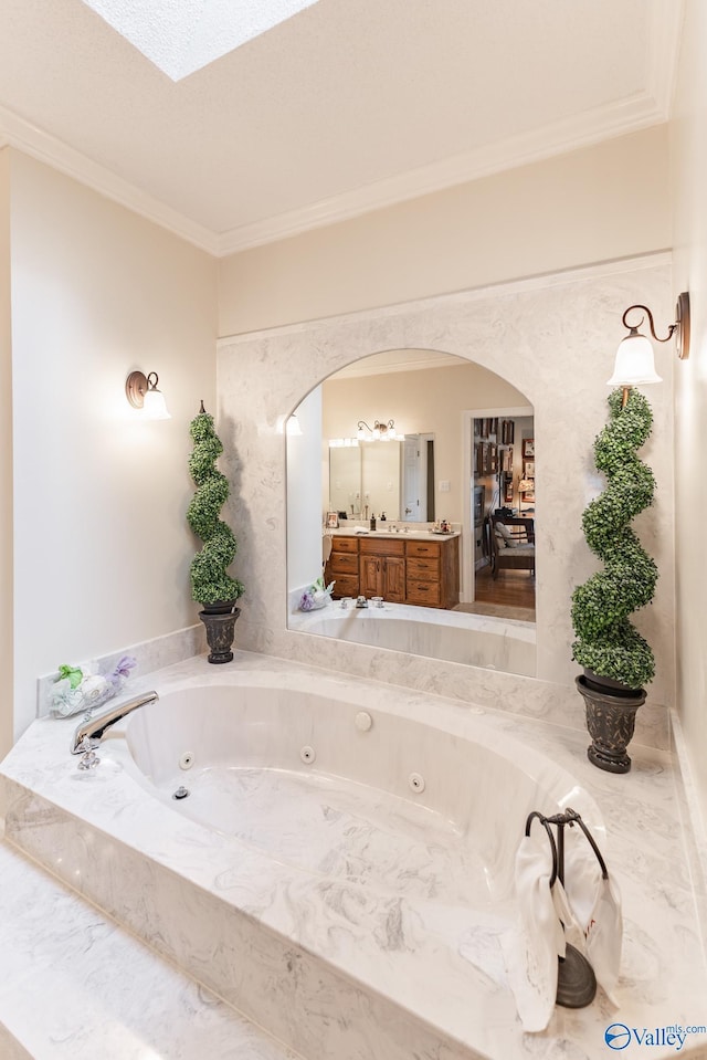 227 Key Turney Rd, Falkville, AL 35622 - bathroom with tiled tub, ornamental molding, and vanity