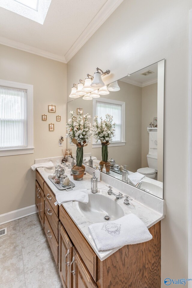 227 Key Turney Rd, Falkville, AL 35622 - bathroom with vanity, plenty of natural light, crown molding, and a skylight