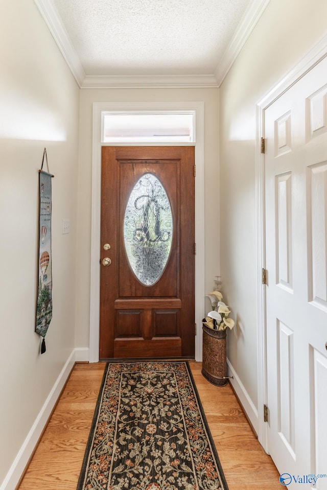 227 Key Turney Rd, Falkville, AL 35622 - doorway with crown molding, a textured ceiling, and light hardwood / wood-style floors