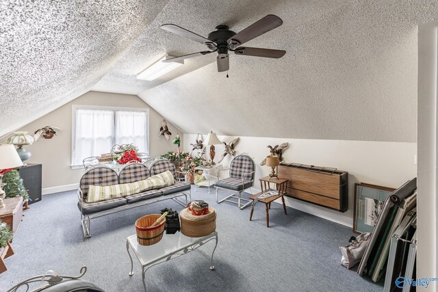 227 Key Turney Rd, Falkville, AL 35622 - bedroom with ceiling fan, carpet flooring, vaulted ceiling, and a textured ceiling