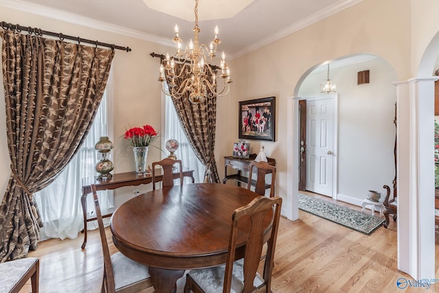 227 Key Turney Rd, Falkville, AL 35622 - dining room featuring an inviting chandelier, crown molding, and light wood-type flooring