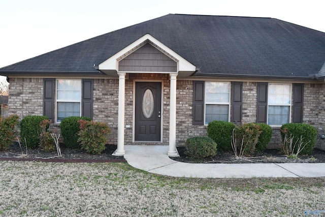 view of front of home featuring a shingled roof