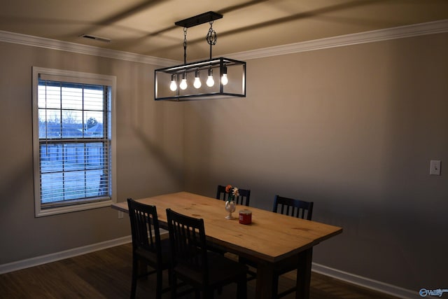 dining room featuring ornamental molding, visible vents, baseboards, and dark wood-style floors