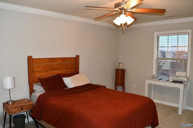 bedroom with baseboards, carpet flooring, crown molding, visible vents, and ceiling fan