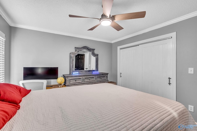 bedroom with ornamental molding, a closet, and a textured ceiling