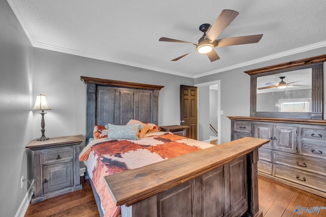 bedroom with ornamental molding, dark hardwood / wood-style floors, and a textured ceiling