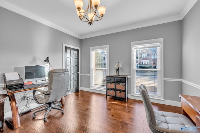 office space featuring dark wood-type flooring, ornamental molding, and a chandelier