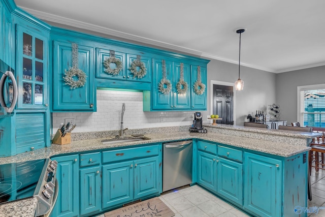 kitchen with pendant lighting, sink, appliances with stainless steel finishes, ornamental molding, and kitchen peninsula