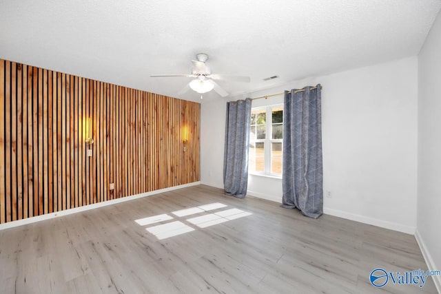 107 Harvest Glen Ln, Harvest, AL 35749 - spare room featuring baseboards, a ceiling fan, and wood finished floors