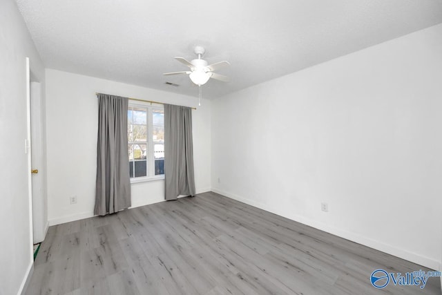 107 Harvest Glen Ln, Harvest, AL 35749 - spare room with baseboards, a ceiling fan, visible vents, and wood finished floors