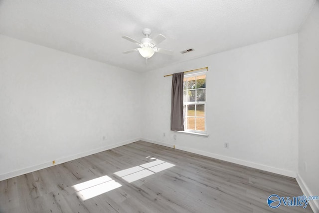 107 Harvest Glen Ln, Harvest, AL 35749 - spare room featuring a ceiling fan, baseboards, visible vents, and wood finished floors