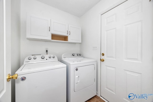 107 Harvest Glen Ln, Harvest, AL 35749 - laundry room featuring washer and clothes dryer and cabinet space