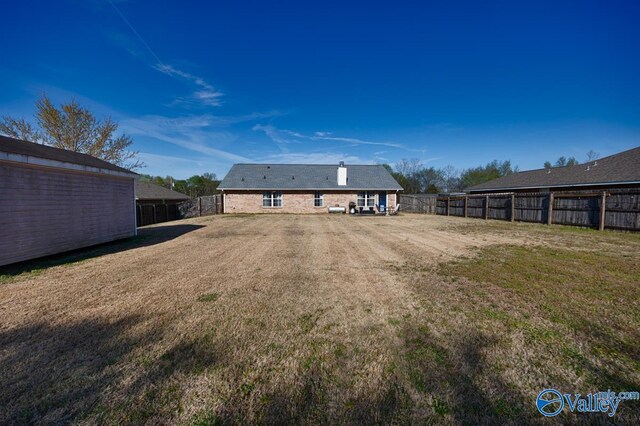 107 Harvest Glen Ln, Harvest, AL 35749 - rear view of property with a yard and a fenced backyard