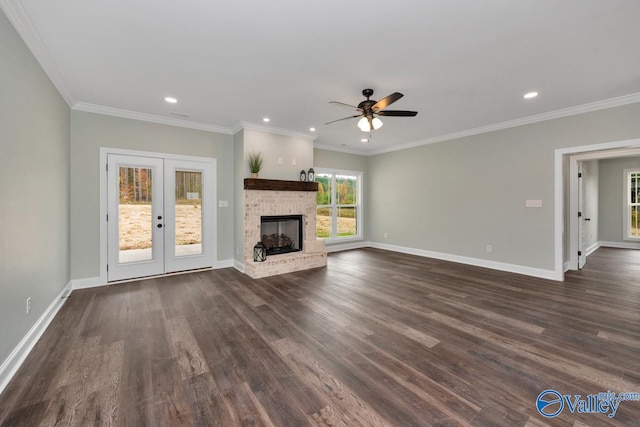 unfurnished living room with crown molding, dark hardwood / wood-style floors, french doors, and ceiling fan