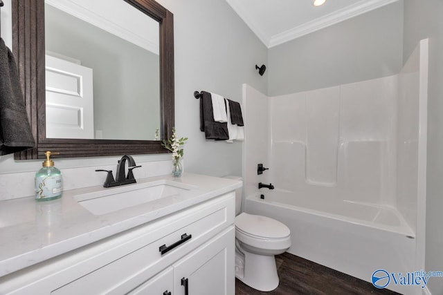 full bathroom with hardwood / wood-style flooring, toilet, ornamental molding, vanity, and shower / bath combination