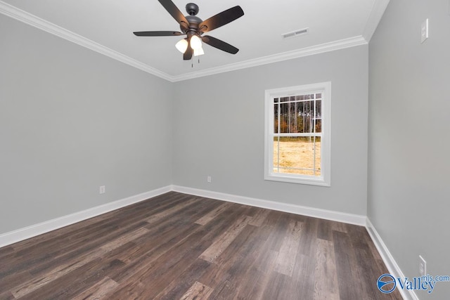 empty room with crown molding, ceiling fan, and dark hardwood / wood-style flooring