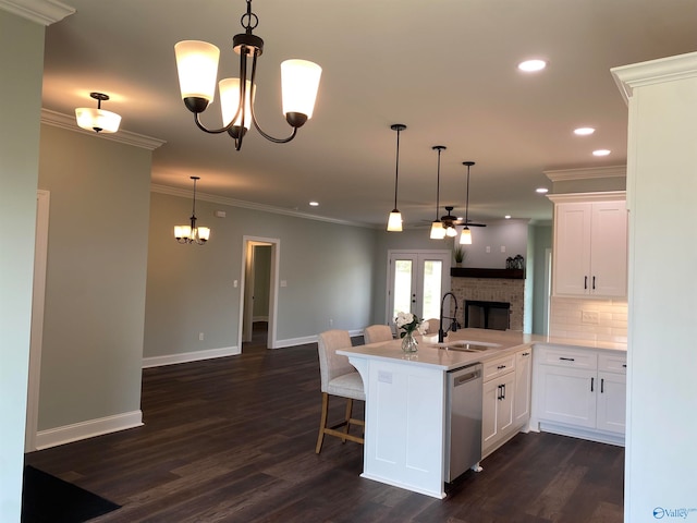 kitchen featuring white cabinetry, dishwasher, sink, and dark hardwood / wood-style floors