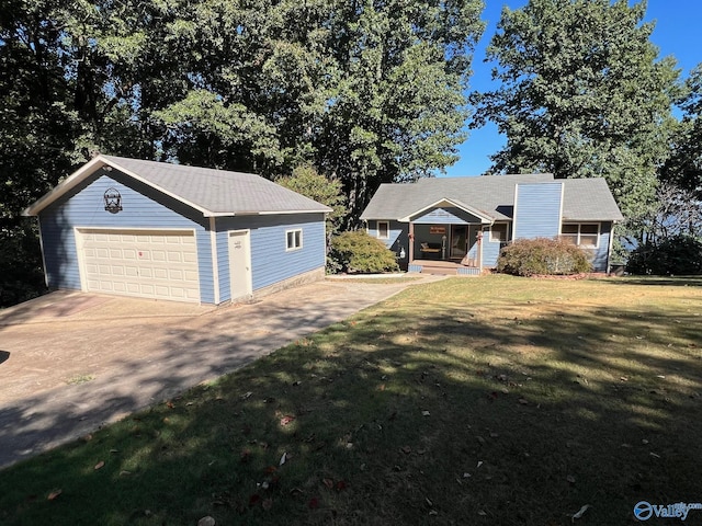 single story home featuring a front lawn, a garage, and an outdoor structure