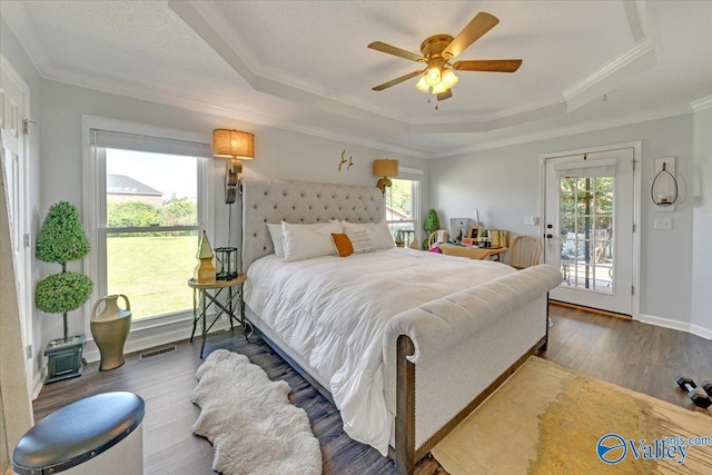 bedroom with access to outside, a raised ceiling, ceiling fan, and ornamental molding