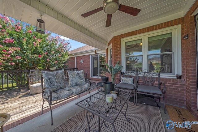 view of patio with a deck and ceiling fan