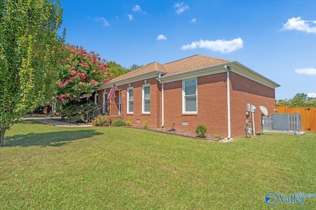 view of side of property featuring a yard