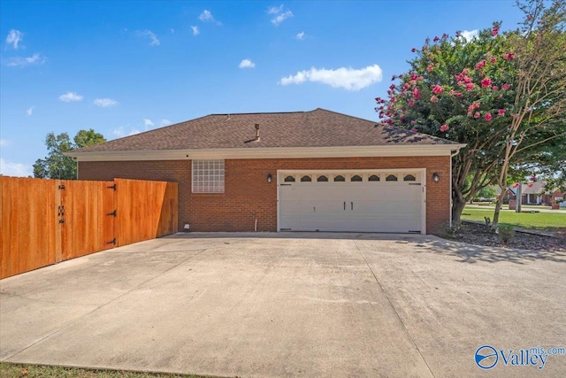 view of side of property with a garage