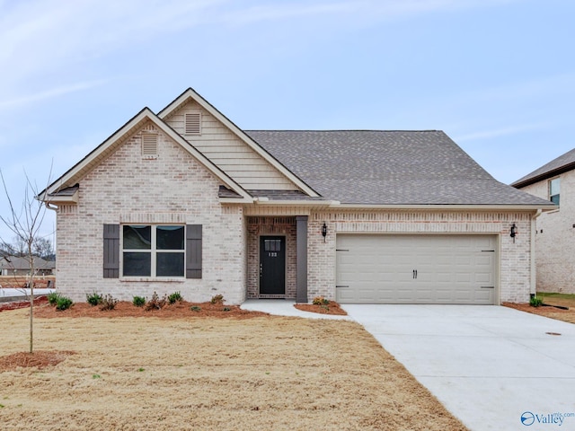 view of front of property with driveway, brick siding, an attached garage, and a shingled roof