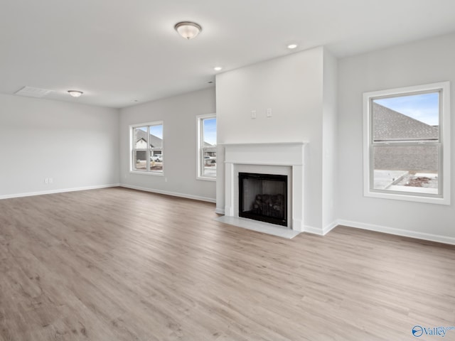 unfurnished living room featuring light hardwood / wood-style flooring