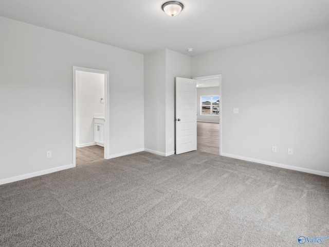 spare room with light colored carpet