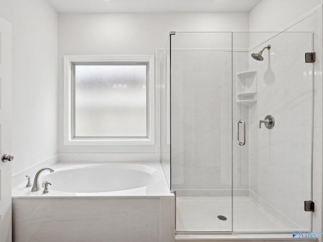 bathroom featuring plus walk in shower