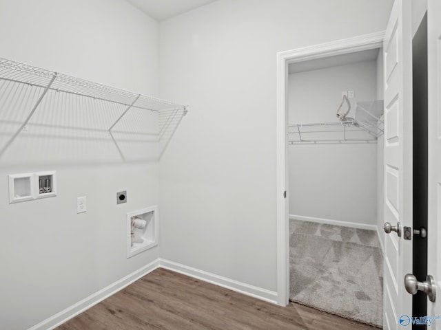 laundry area with hookup for a washing machine, hardwood / wood-style floors, and hookup for an electric dryer