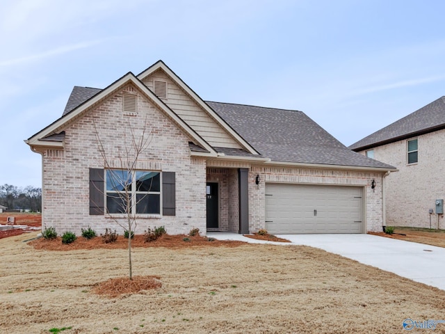 view of front of property featuring driveway, brick siding, roof with shingles, and an attached garage