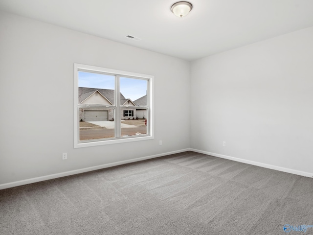 spare room featuring carpet flooring