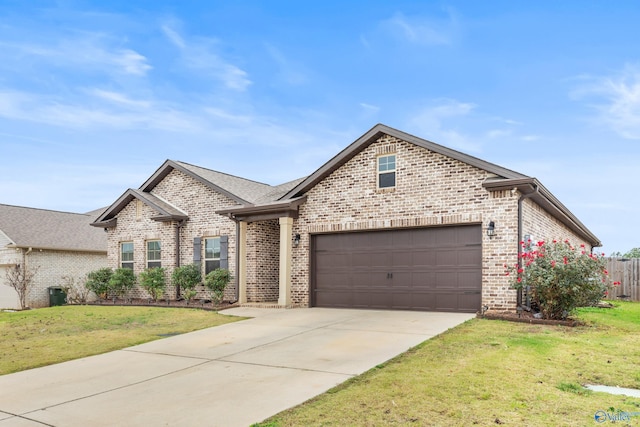 view of front of home with a front yard and a garage