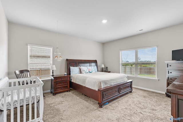 bedroom with light colored carpet