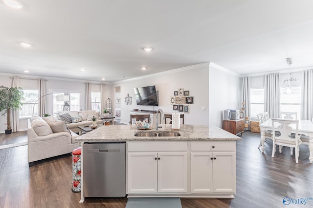 kitchen featuring an island with sink, dishwasher, ornamental molding, a sink, and open floor plan