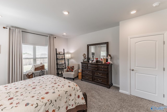 bedroom featuring light carpet, baseboards, and recessed lighting