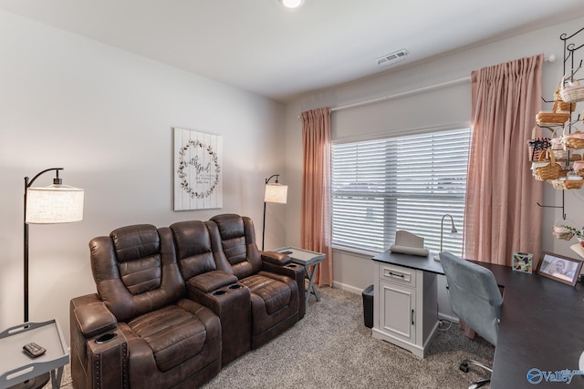home office featuring baseboards, visible vents, and light colored carpet