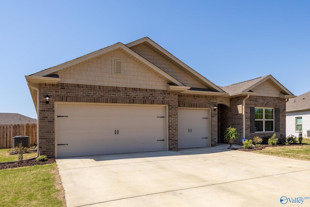 ranch-style home featuring brick siding, an attached garage, concrete driveway, and fence