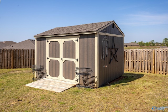view of shed featuring a fenced backyard